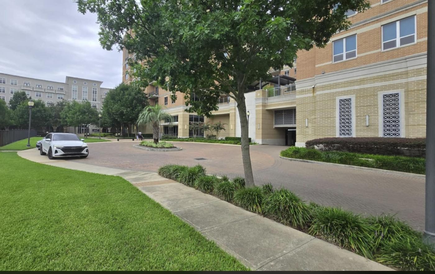 The landscaped circle drive curving in front of the lobby